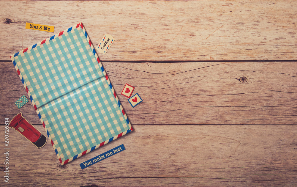 Flat view of empty postcard mock up frame decorate with stickers on wooden beige table Flat view of empty postcard mock up frame decorate with stickers on wooden beige table