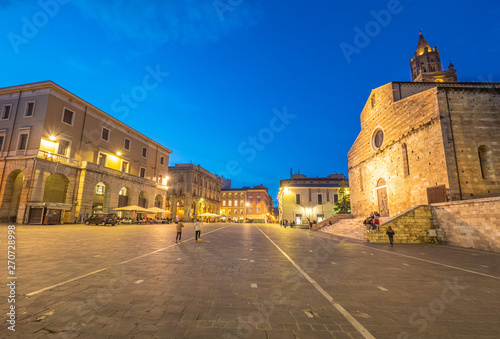 Teramo (Italy) - The elegant historical center, with street and stone church, of this hill and province city in Abruzzo region. photo