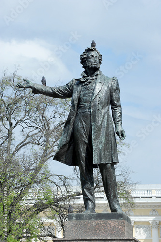 sculpture to Russian poet Pushkin with pigeons sitting on the sculpture
