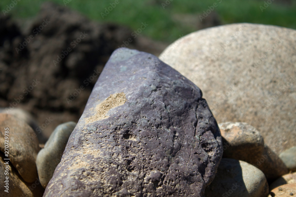 Smooth stone. Stones background and texture. Natural background. Selective focus. Smooth stone. Stones background and texture. Natural background. Selective focus.