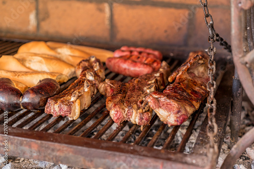 Obraz na płótnie "Parrillada" Argentine barbecue make on live coal (no flame), beef "asado", brea