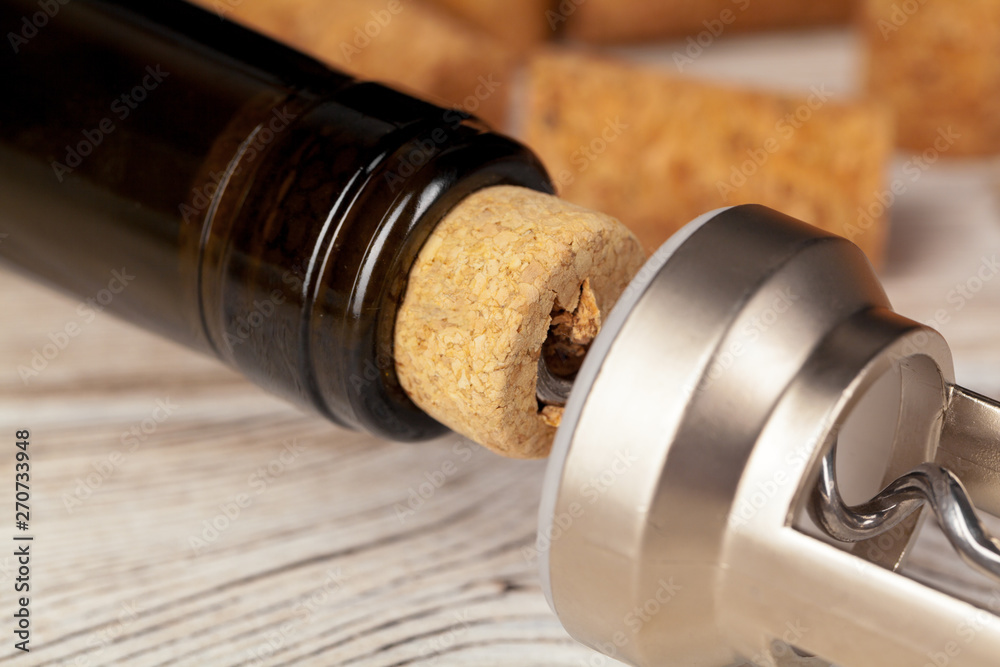 Cork screw for wine and corks close up