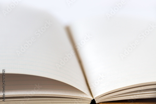 Open blank notebook closeup view