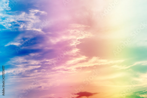 A soft fog cloud background with pastel colored orange to blue gradient © Theeranad