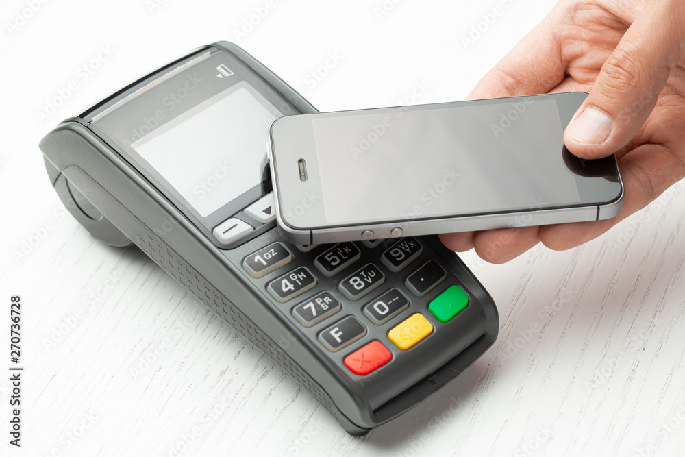 Contactless payment by smartphone phone. POS terminal NFC payment. Concept of how to choose payment method for shopping in store. Contactless payment by smartphone phone. POS terminal NFC payment. Concept of how to choose payment method for shopping in store.