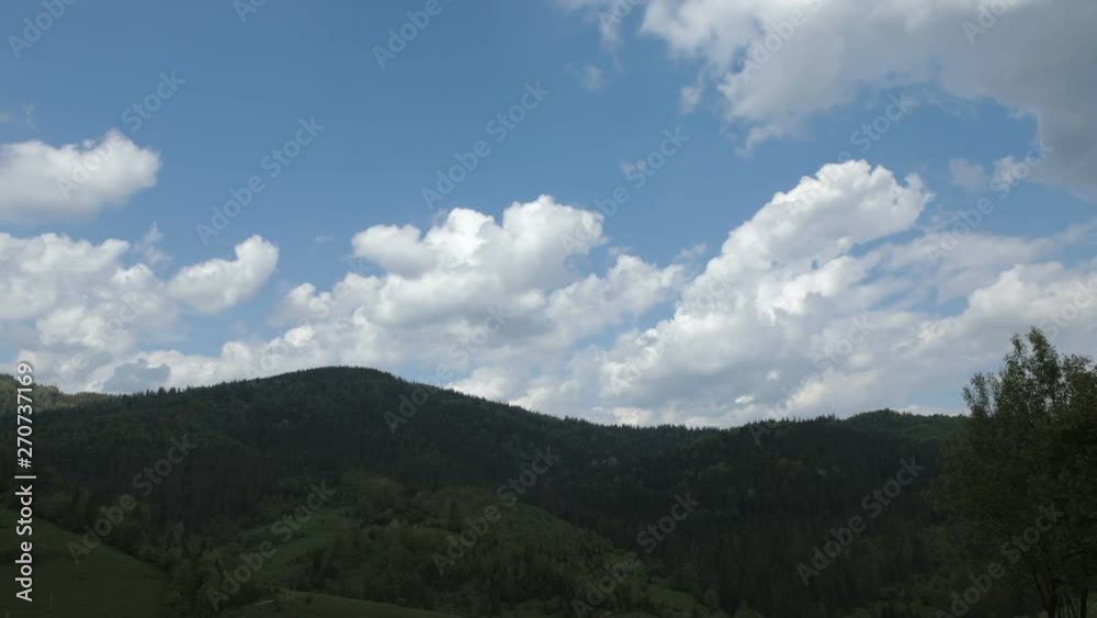 Time lapse of blue sky with clouds over mountain Time lapse of blue sky with clouds over mountain