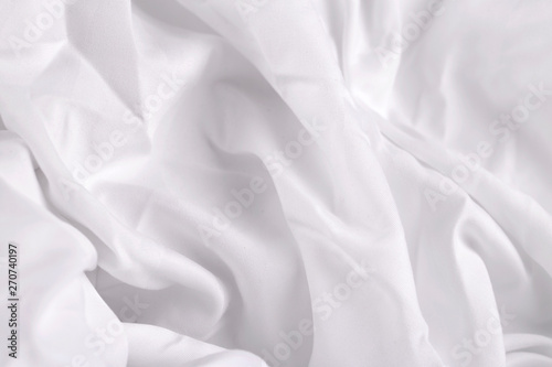 white silk or satin luxury cloth texture background, Smooth elegant fabric bed sheet texture photo