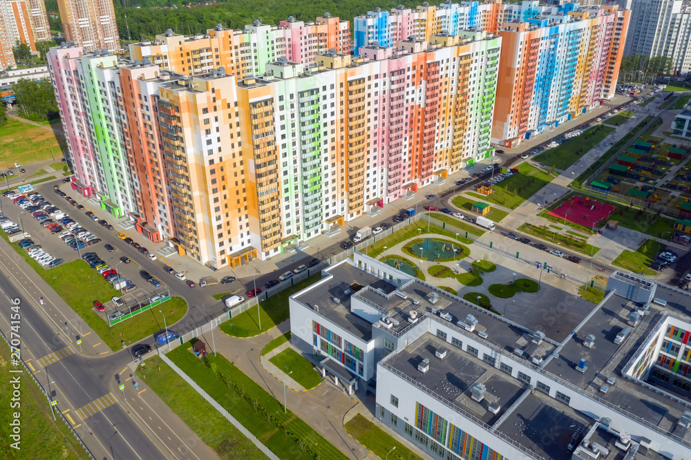 Fototapeta premium MOSCOW, RUSSIA - MAY 26, 2019: Top view of the new colorful residential area of Moscow on a summer evening