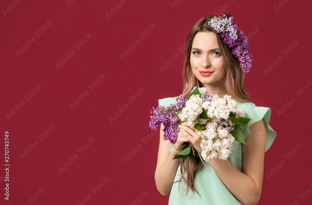 Beautiful young woman with lilac flowers on color background Beautiful young woman with lilac flowers on color background