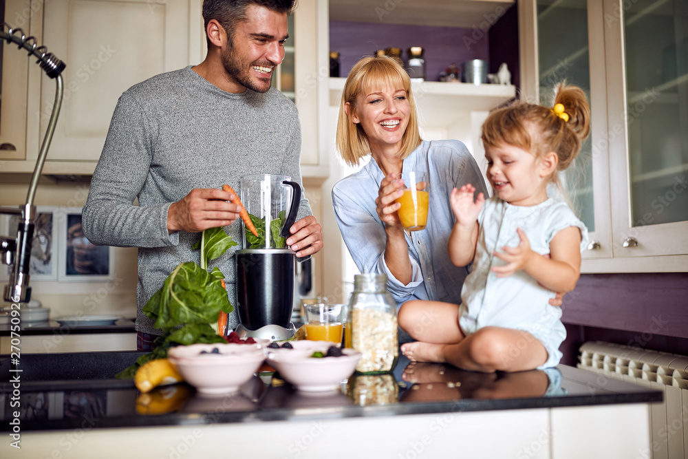 Parents with daughter having breakfast Parents with daughter having breakfast