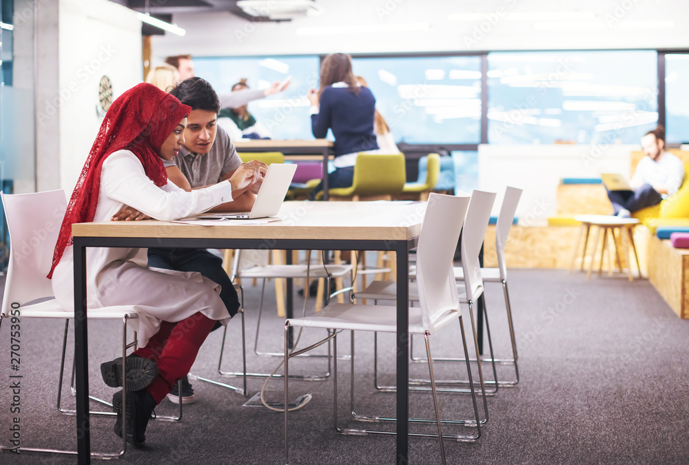 black muslim business woman having a meeting with her indian male colleague black muslim business woman having a meeting with her indian male colleague