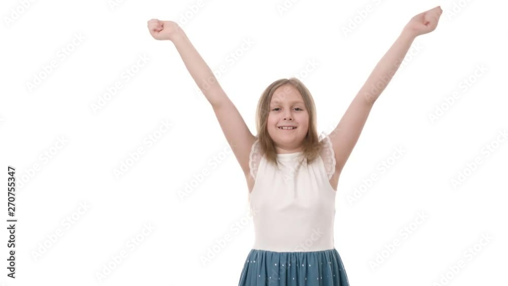 Video portrait of a beautiful happy little girl hands up isolated on white background. Childhood concept. Studio shot of child emotions in 4K definition. Video portrait of a beautiful happy little girl hands up isolated on white background. Childhood concept. Studio shot of child emotions in 4K definition.