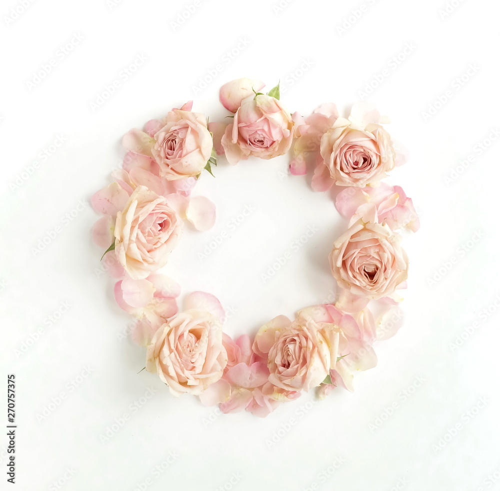 Wreath Flowers composition background . Pink roses pattern frame, circle  on white background. Top view. Copy space. Holiday concept