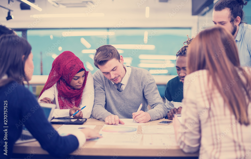 Multiethnic startup business team having meeting Multiethnic startup business team having meeting
