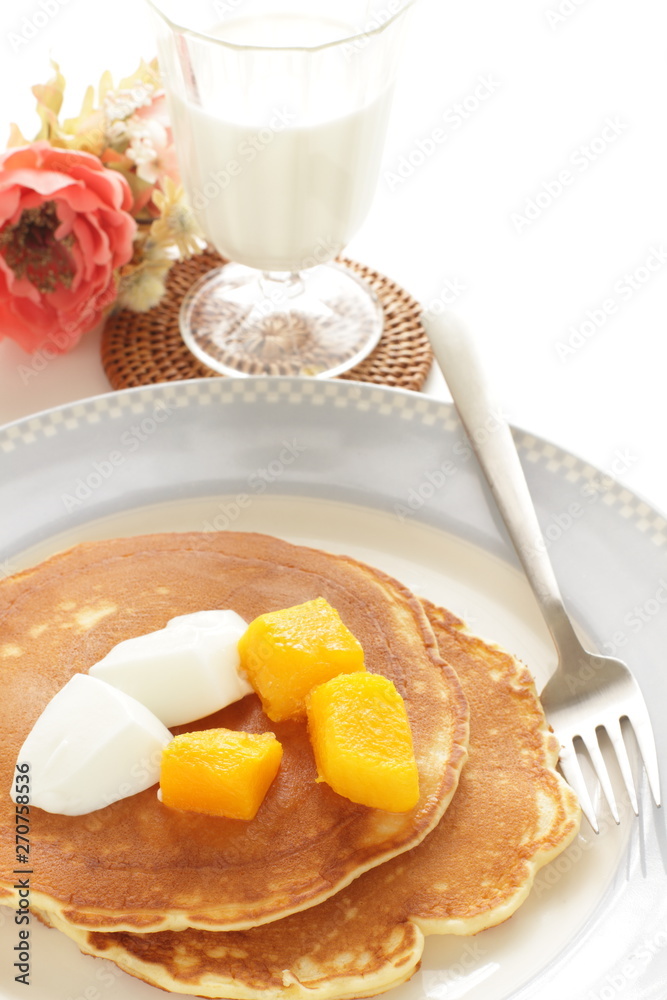 Fototapeta premium Frozen mango on panccake with copy space