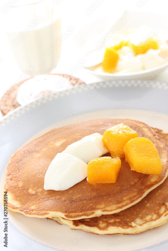 Frozen mango on panccake with copy space Frozen mango on panccake with copy space