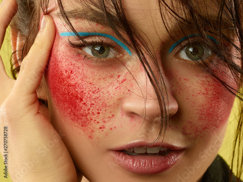Strawberry eyes. Beautiful female face with perfect skin and bright make up. Concept of natural beauty, skin care, treatment, health, cosmetic. A creative artistic stage act and signature character.
