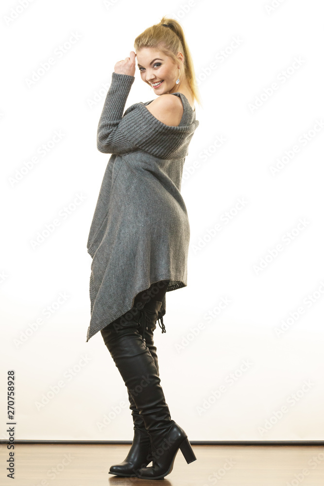 Woman wearing gray long top sweater tunic Woman wearing gray long top sweater tunic