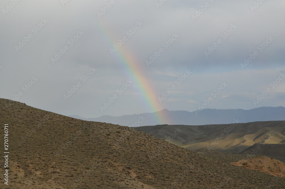 Rainbow in the mountain valley