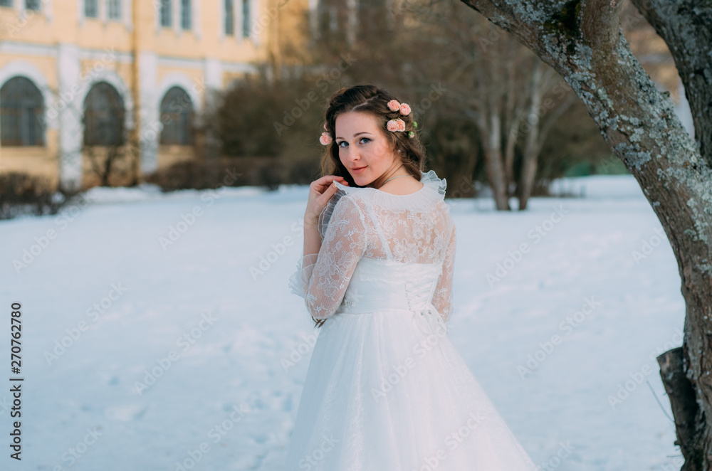 Bride with roses in hair turned back Bride with roses in hair turned back