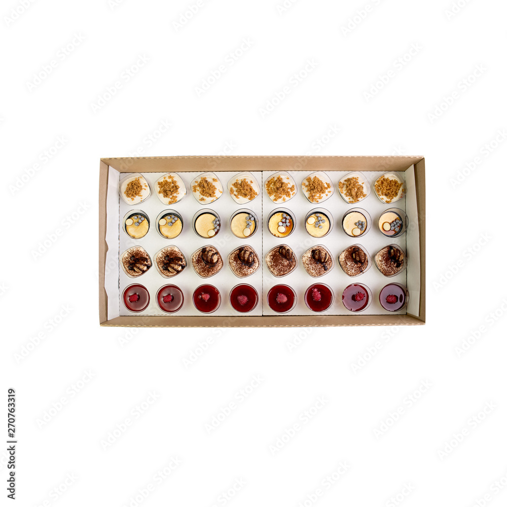 Collection of take away kraft boxes with different desserts on white background, top view. Collection of take away kraft boxes with different desserts on white background, top view.