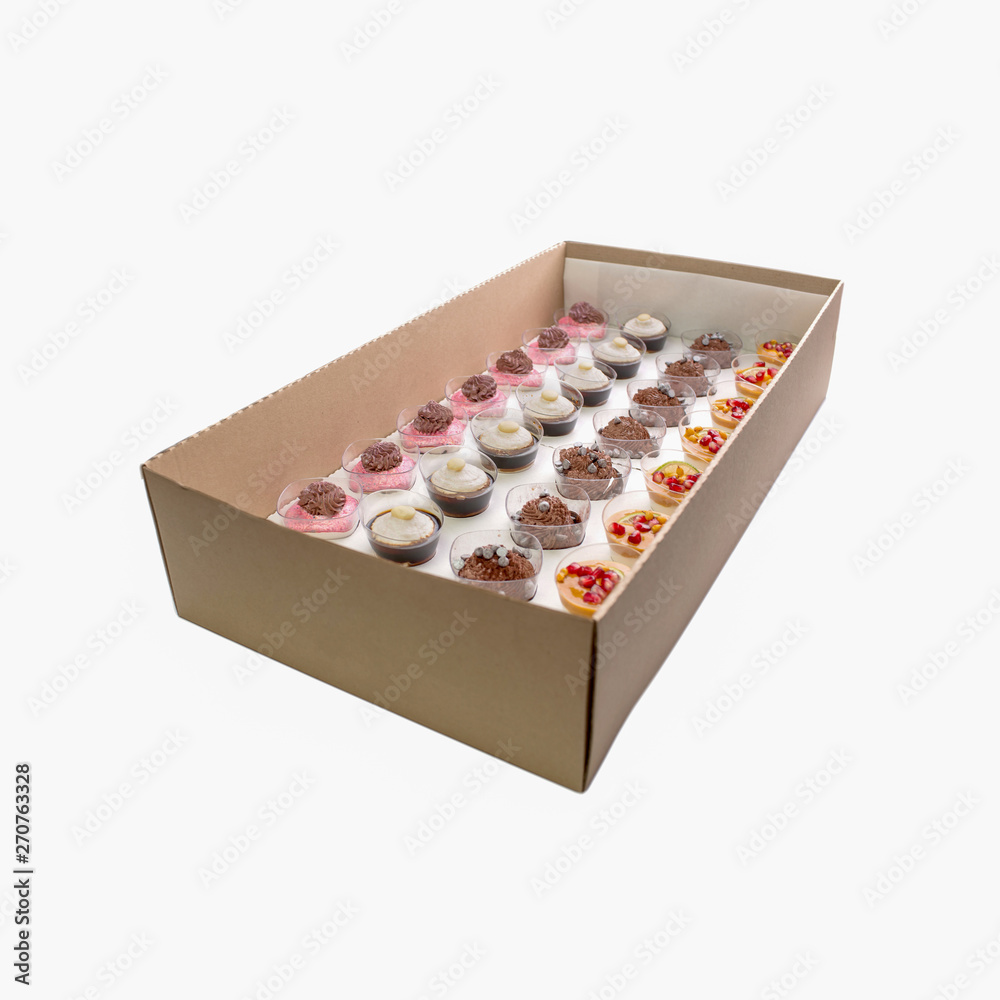 Collection of take away kraft boxes with different desserts on white background, top view. Collection of take away kraft boxes with different desserts on white background, top view.