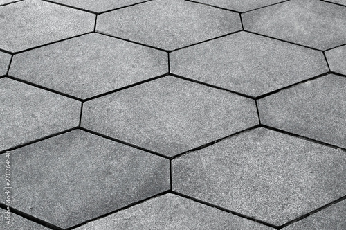 Texture of gray hexagonal paving slabs