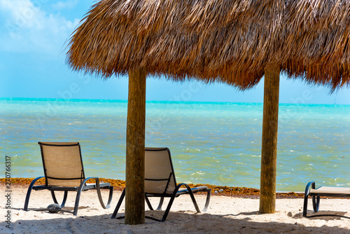 Fototapeta Naklejka Na Ścianę i Meble -  Beach chairs and canopy by the sea in Florida Keys
