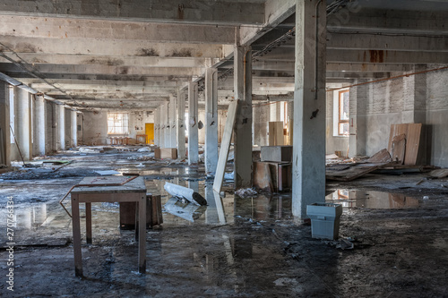 Hall in abandoned textile factory that is bankrupt and demolished.