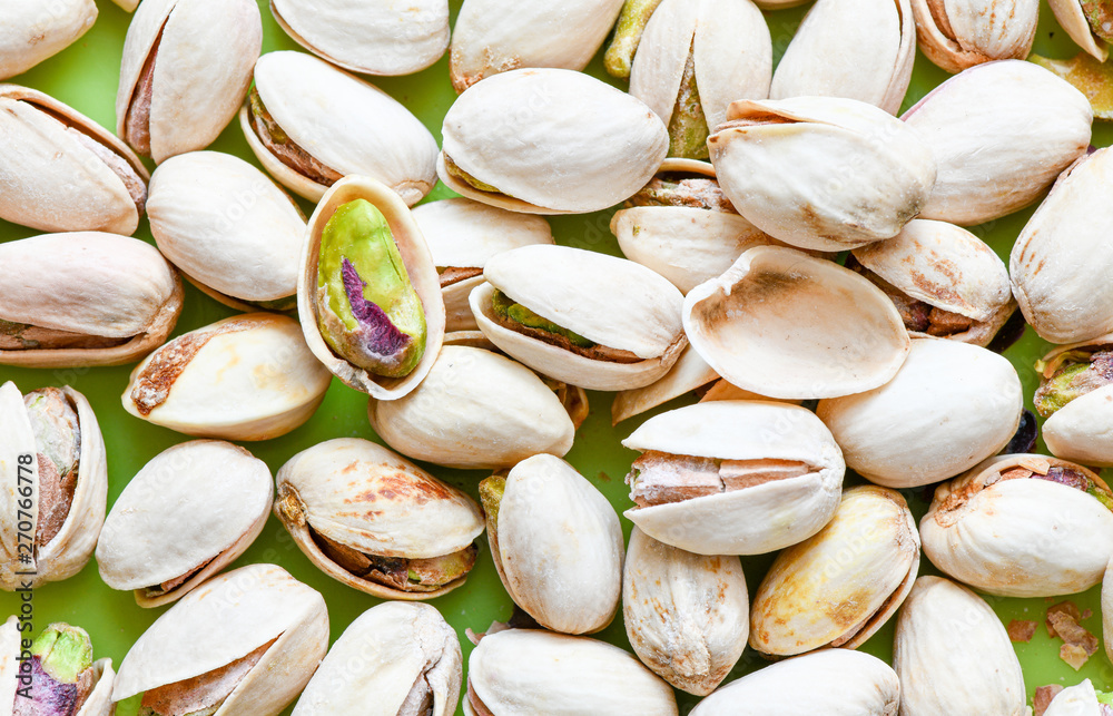 Roasted salted pistachio in shell texture, background