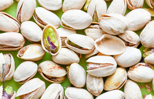 Roasted salted pistachio in shell texture, background