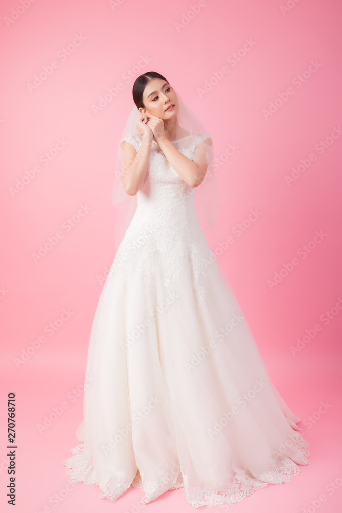 Beautiful asian bride portrait in pink studio
