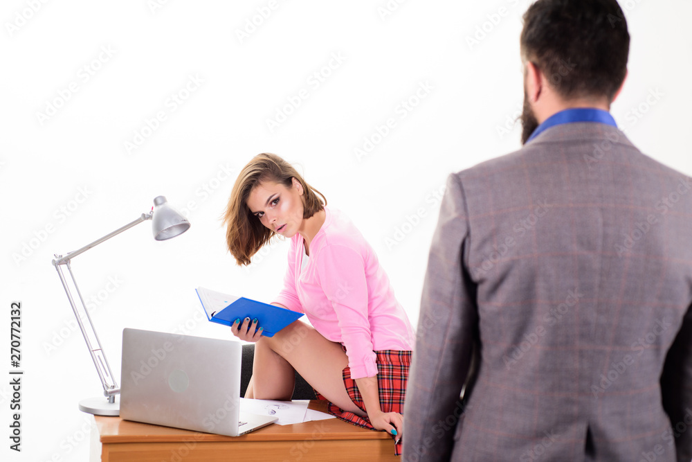 Corporate business education. Businessman in foreground looking at pretty teacher in school for adult education. Sexy education worker and male student. Providing education and advanced training Corporate business education. Businessman in foreground looking at pretty teacher in school for adult education. Sexy education worker and male student. Providing education and advanced training