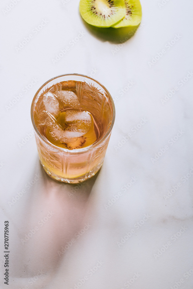 A glass of pink wine in a crystal glass on a marble background A glass of pink wine in a crystal glass on a marble background