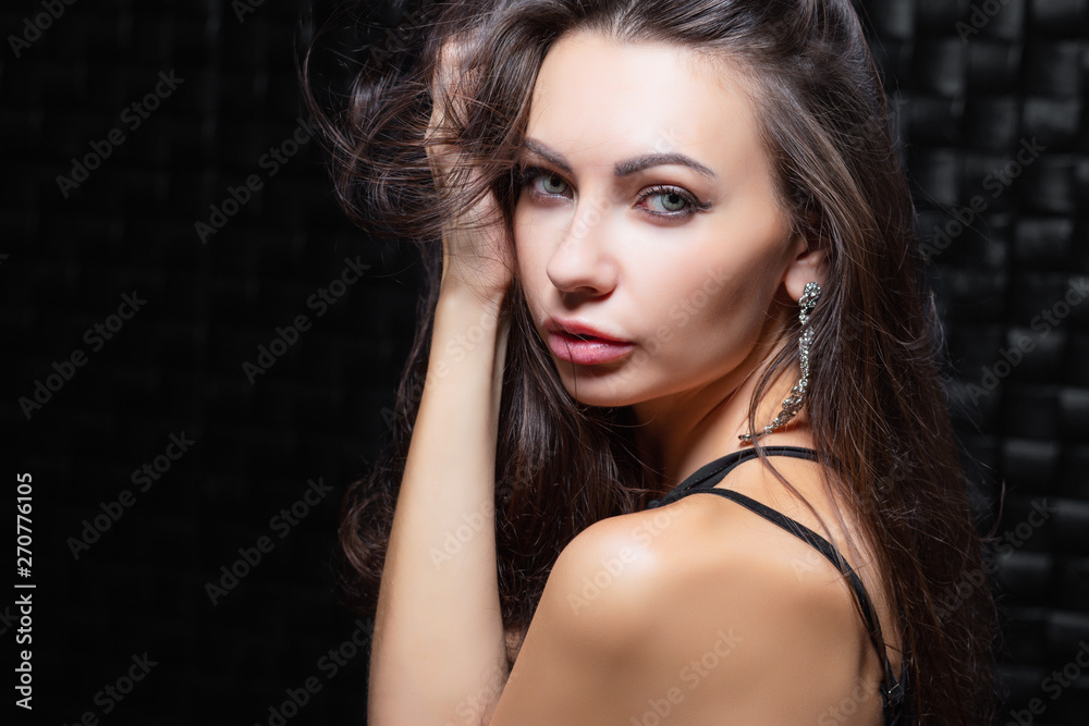 Fototapeta premium Portrait of a pretty young brunette.