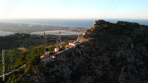 Aerial drone view of telecommunication antennas at sunset, in Segaria mountain, in Marina Alta, Alicante, Spain photo