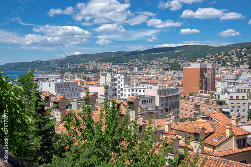 Amazing aerial view to Trieste city. Group of buildings view from fortress. Beautiful sunny day.