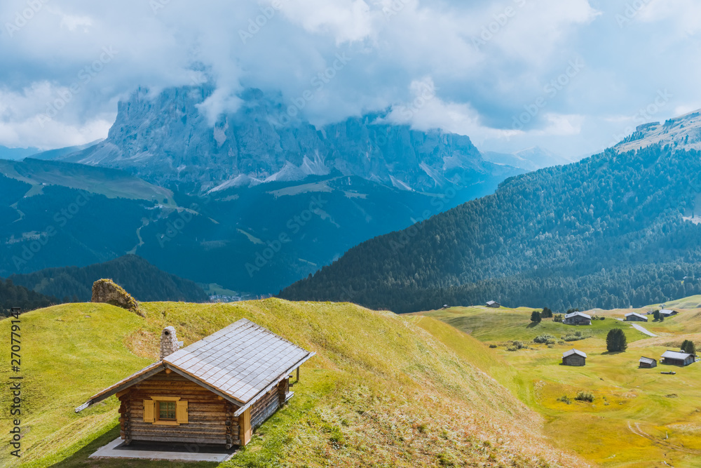 road and houses, green fields at Dolomites mountains, Odle Puez, Italy road and houses, green fields at Dolomites mountains, Odle Puez, Italy