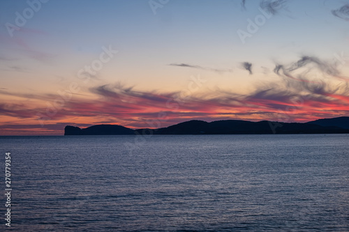 Dramatic sunset over the sea front in Alghero  L Alguer   province of Sassari   Sardinia  Italy.