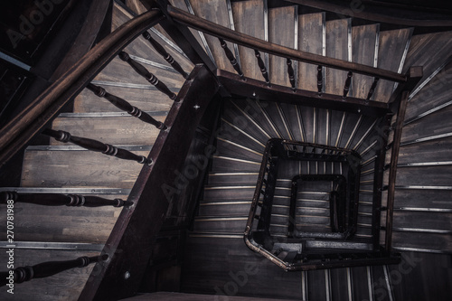 Fényképezés Old wooden spiral staircase without people top view