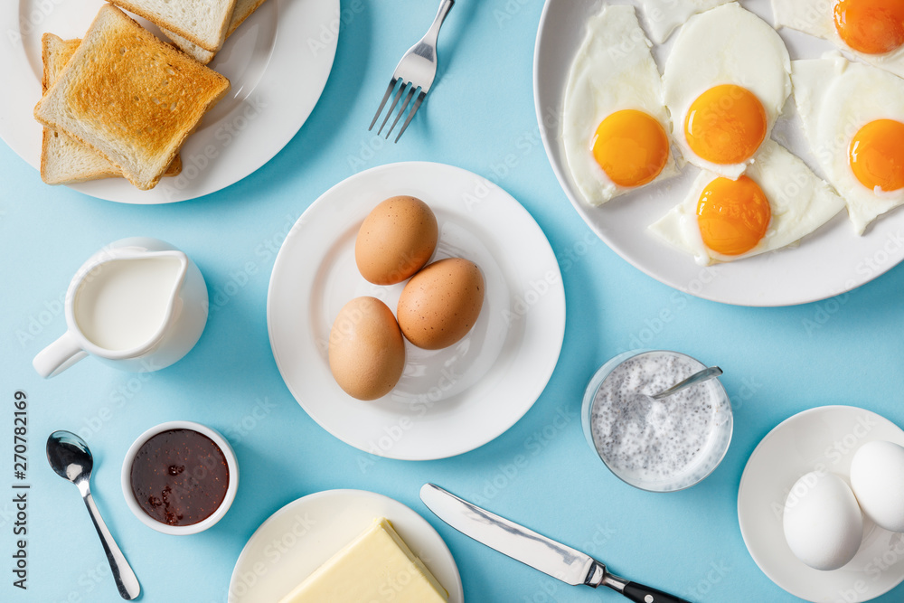 top view of breakfast with yogurt on blue background