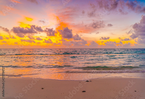 Beautiful sunset with sky over calm sea  in tropical Maldives island . © jannoon028