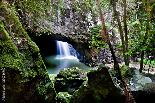 Close up of rocks and a waterfall in the cave