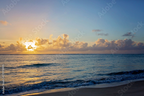 Luxury beach hotel  silhouette of palm trees  swimming pool  an beautiful sunrise