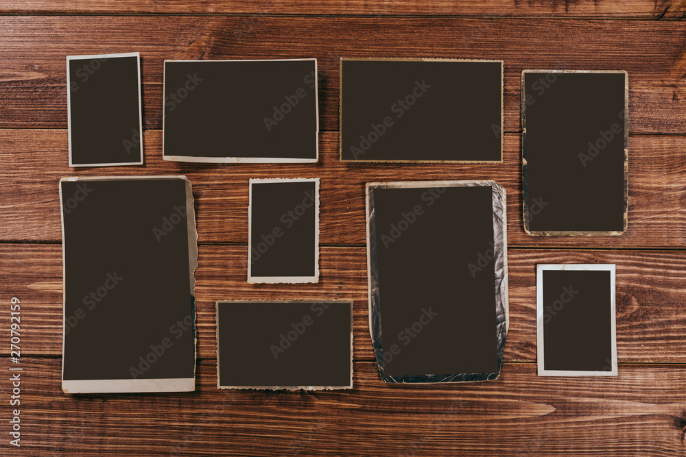 retro some old photos on wooden table retro some old photos on wooden table