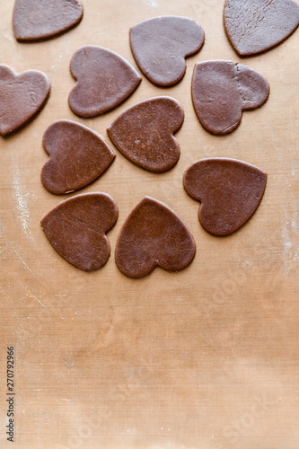 Chocolate hearts on background. Chocolate heart on wooden background