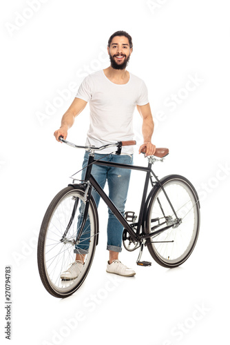cheerful latin man with bicycle isolated on white
