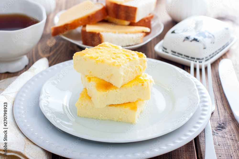 lush omelette for breakfast on a white plate, horizontal