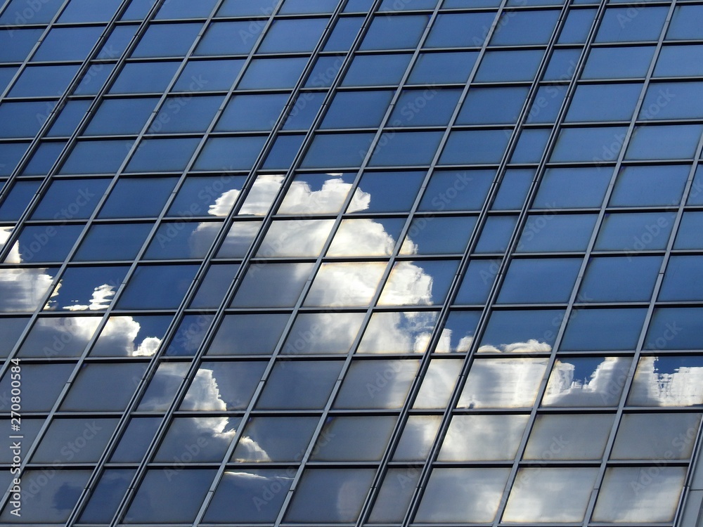 glass of building with reflection of blue sky and cloud glass of building with reflection of blue sky and cloud