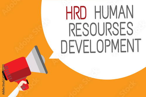 Text sign showing Hrd Human Resources Development. Conceptual photo helping employees develop personal skills Man holding megaphone loudspeaker speech bubble message orange background